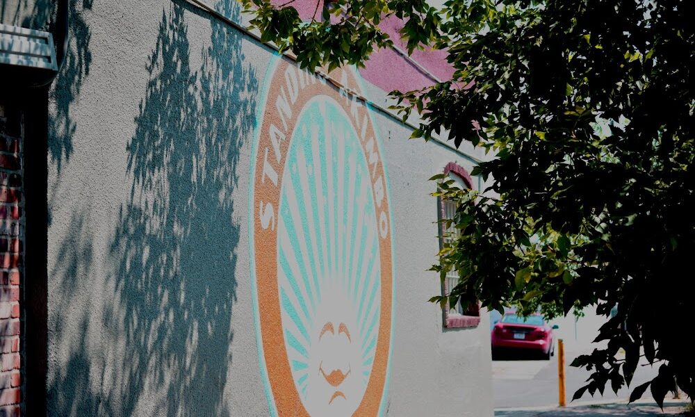 Standing Akimbo Denver